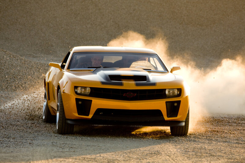 Yellow car drifting on gravel