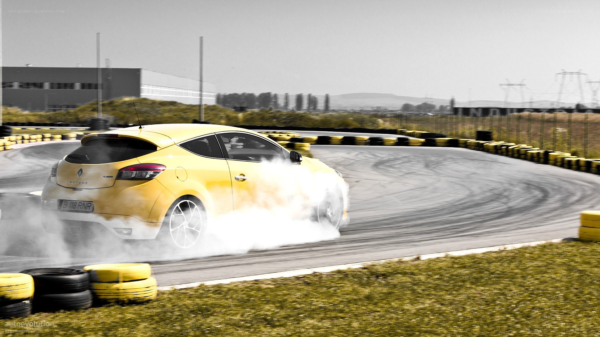 Yellow car drifting on track