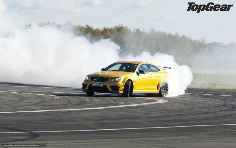 Yellow car drifting on track