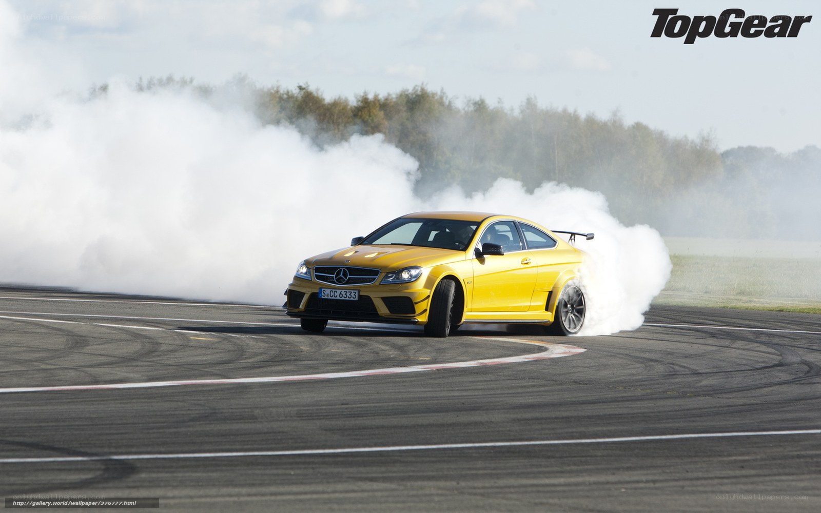 Yellow car drifting on track
