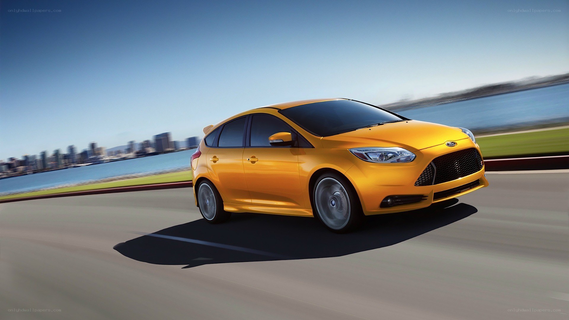 yellow car driving on road