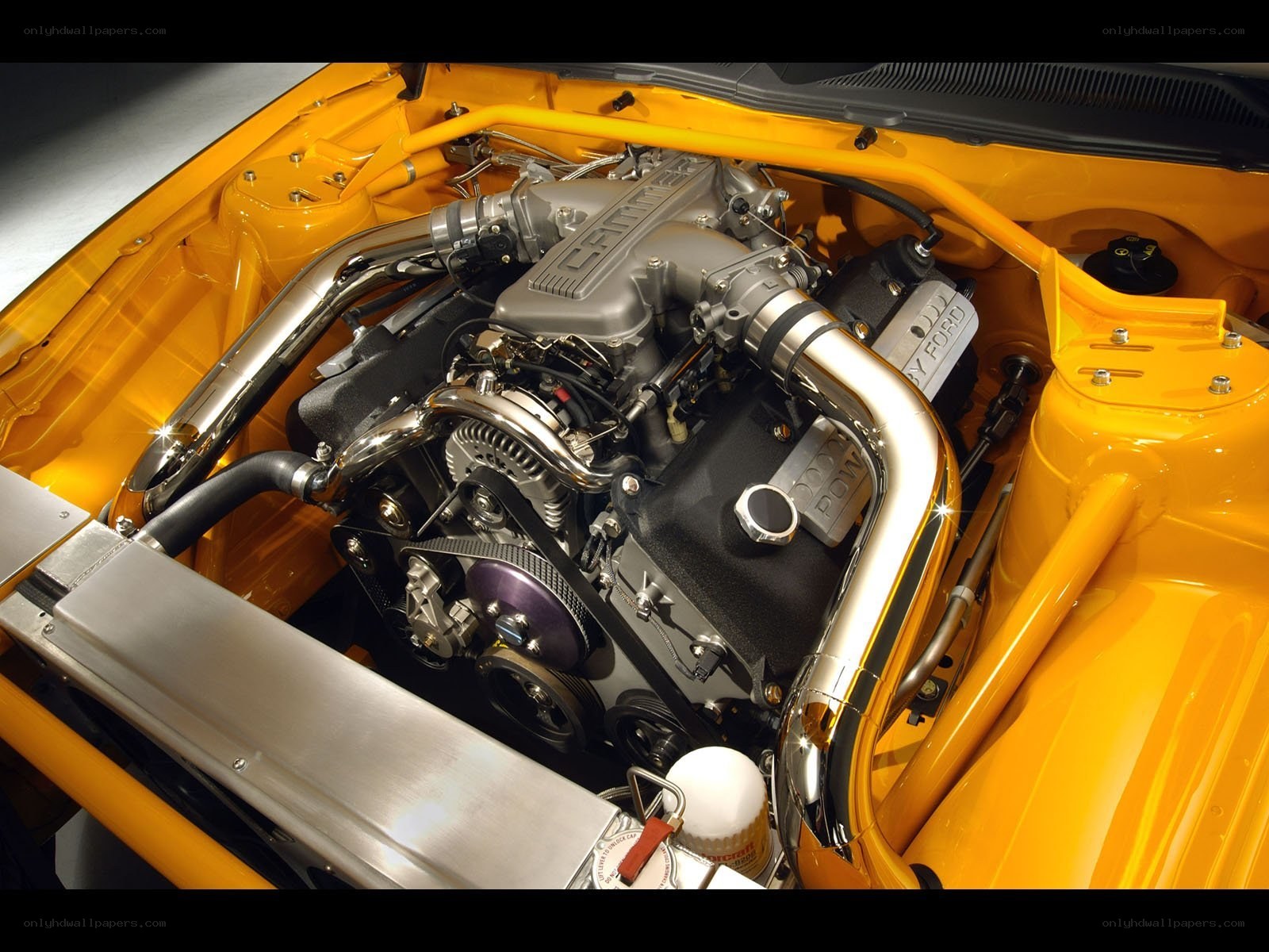 yellow car engine bay