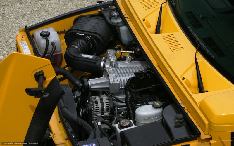 yellow car engine bay
