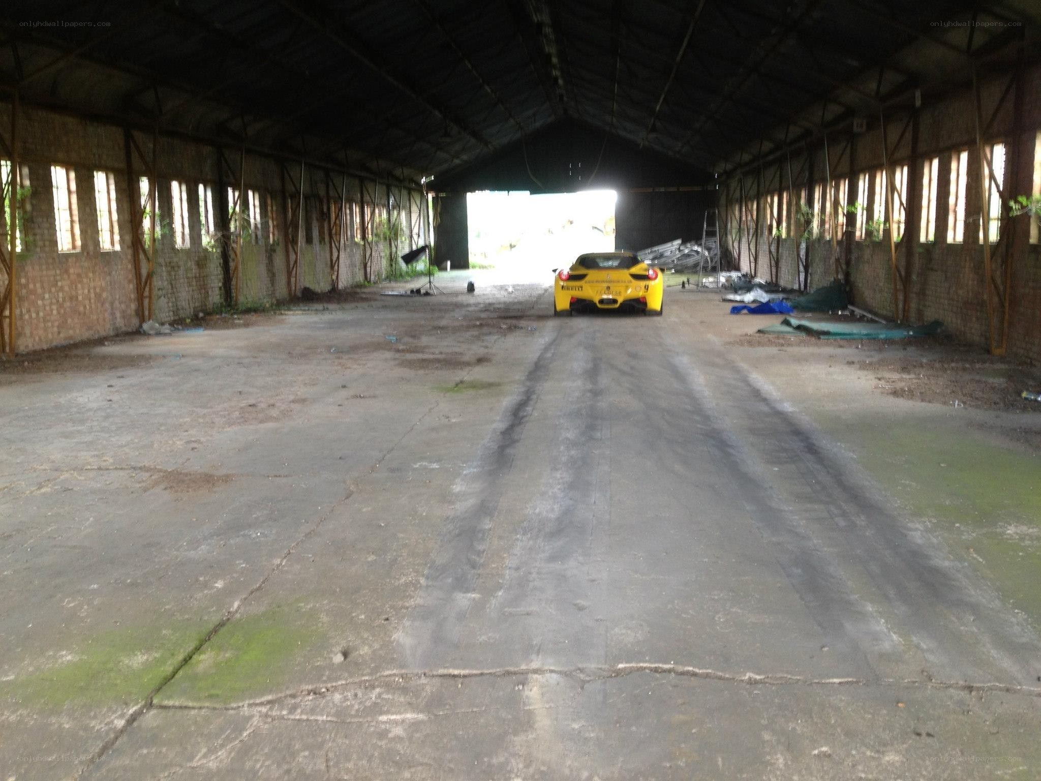 Yellow car in abandoned warehouse