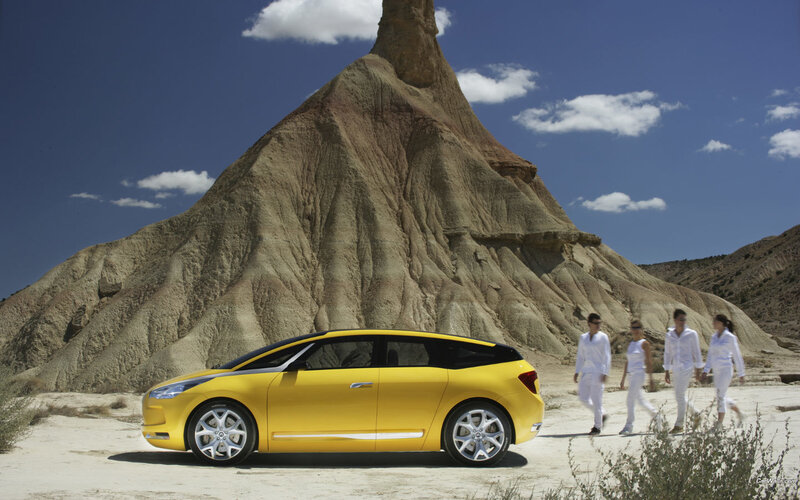 Yellow car in desert landscape