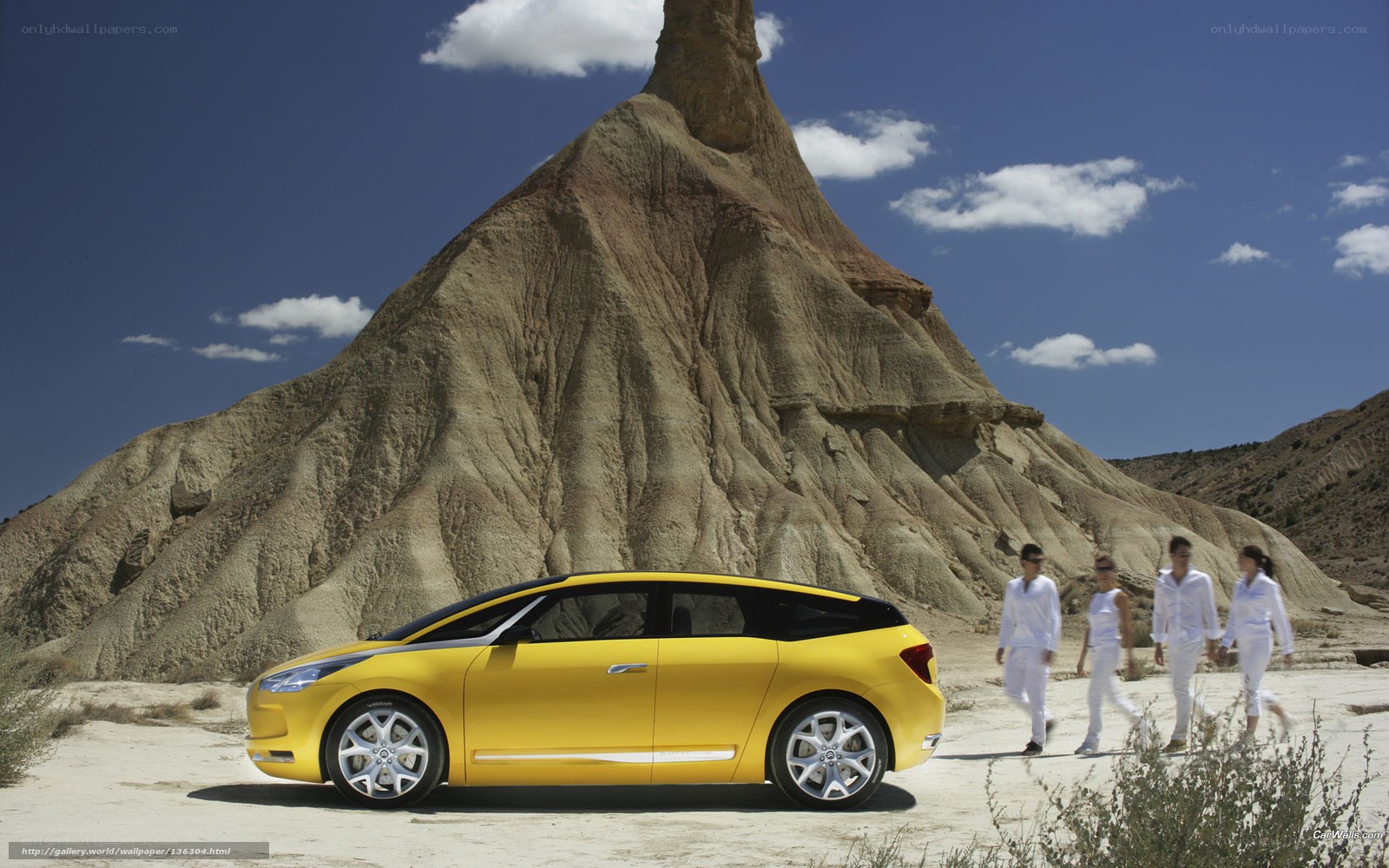 Yellow car in desert landscape