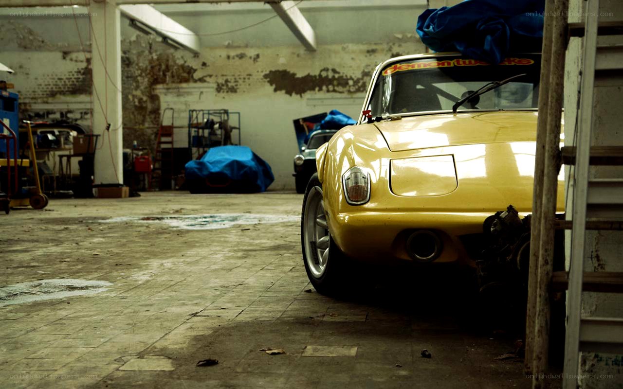 yellow car in garage