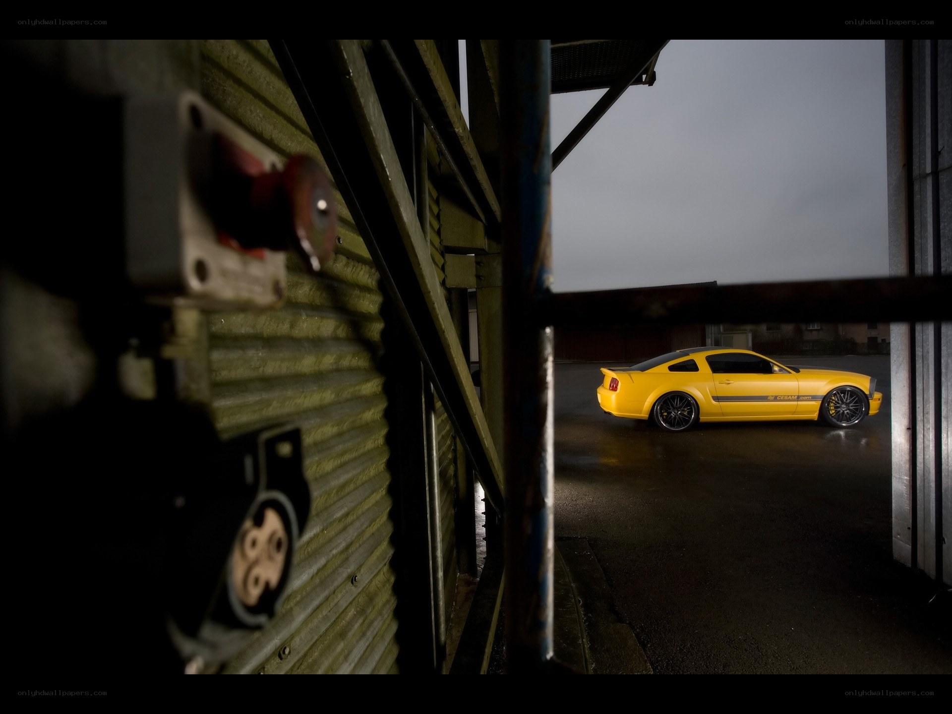 Yellow car in industrial setting