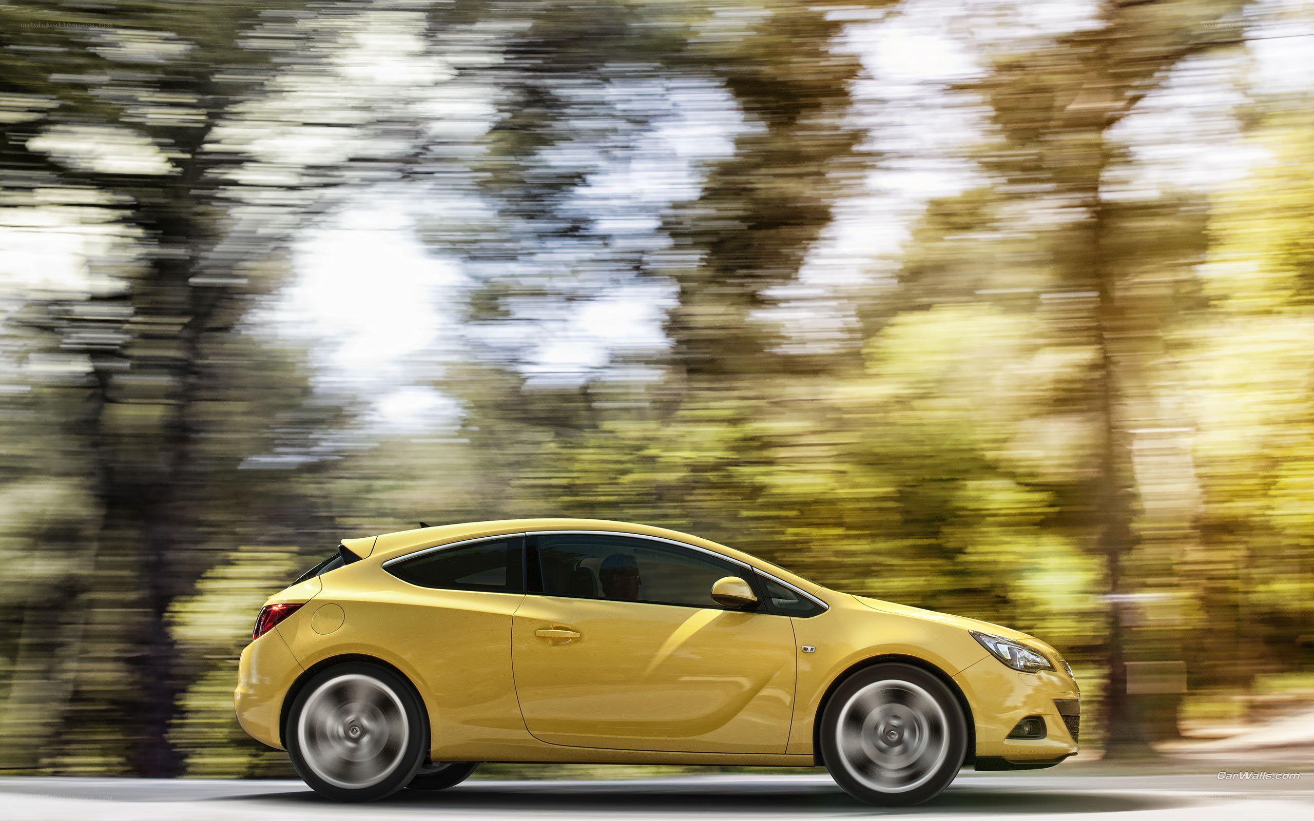yellow car in motion