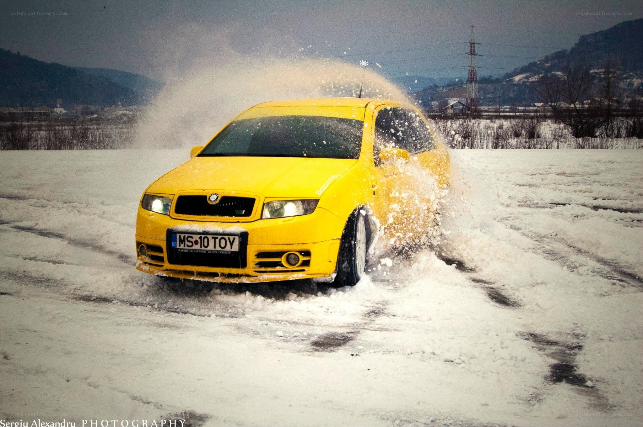 Yellow car in snow drift