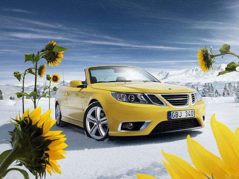Yellow car in snowy landscape