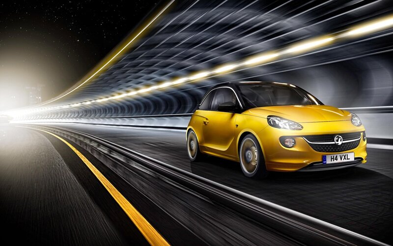Yellow car in tunnel at night