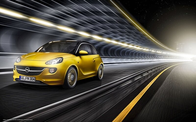 Yellow car in tunnel at night