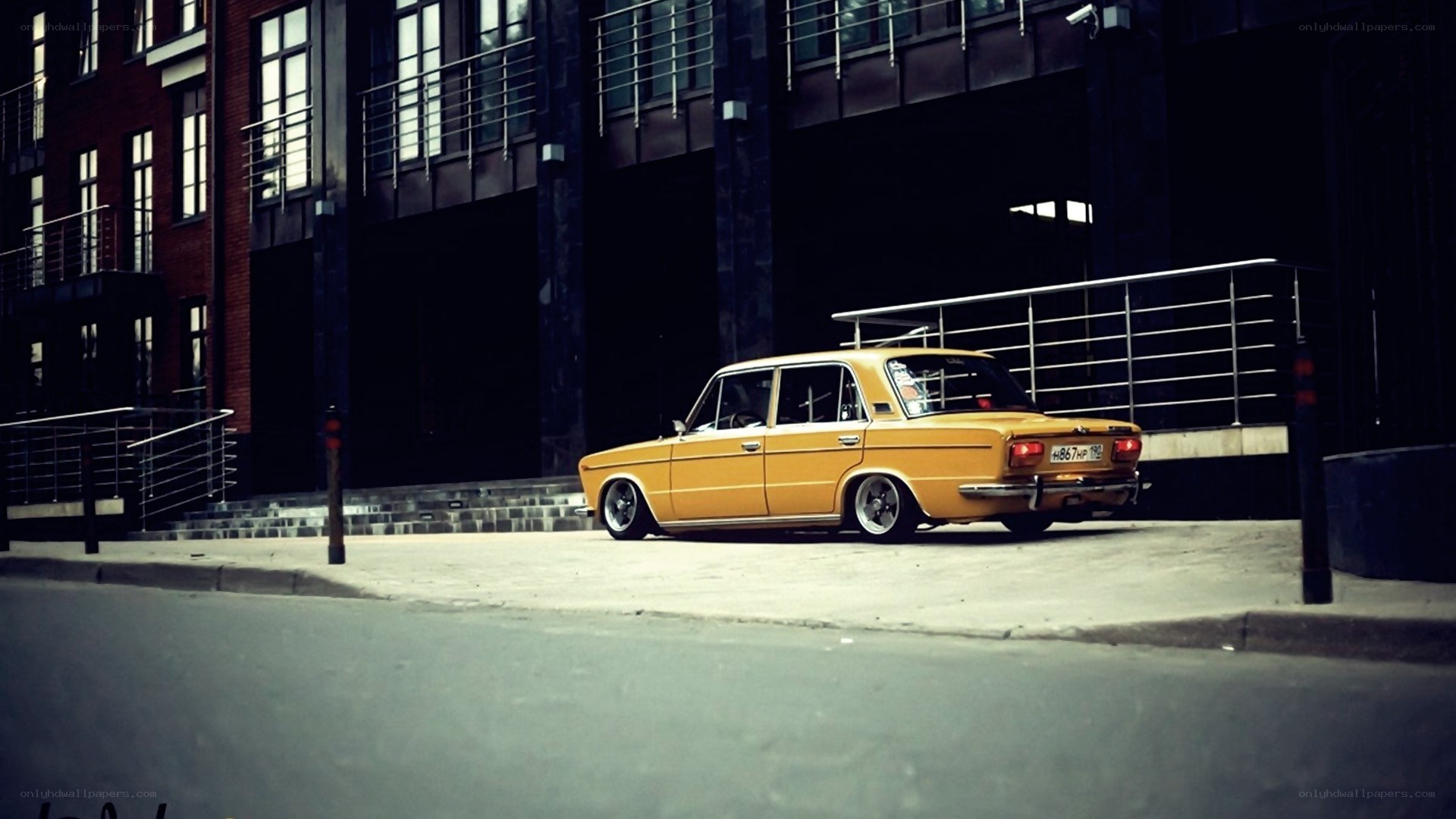 yellow car in urban setting