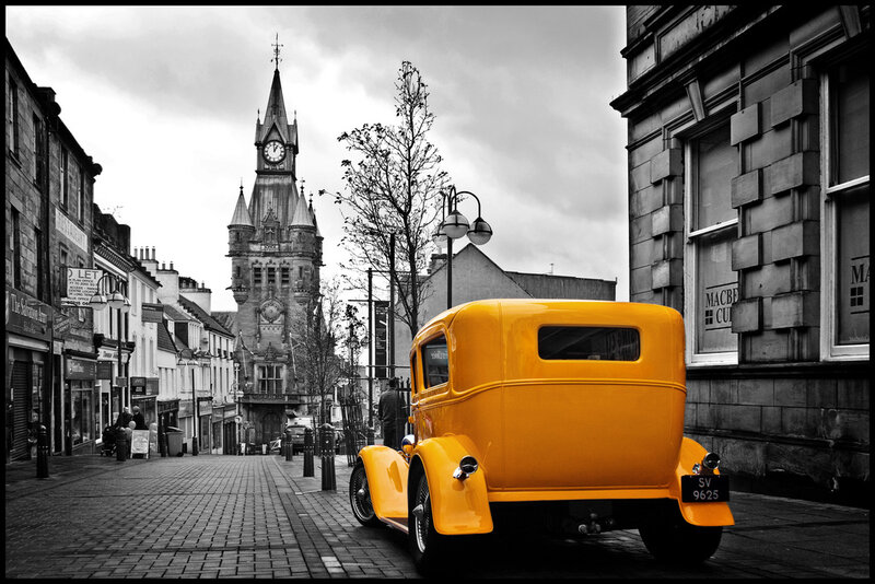 Yellow car on a city street