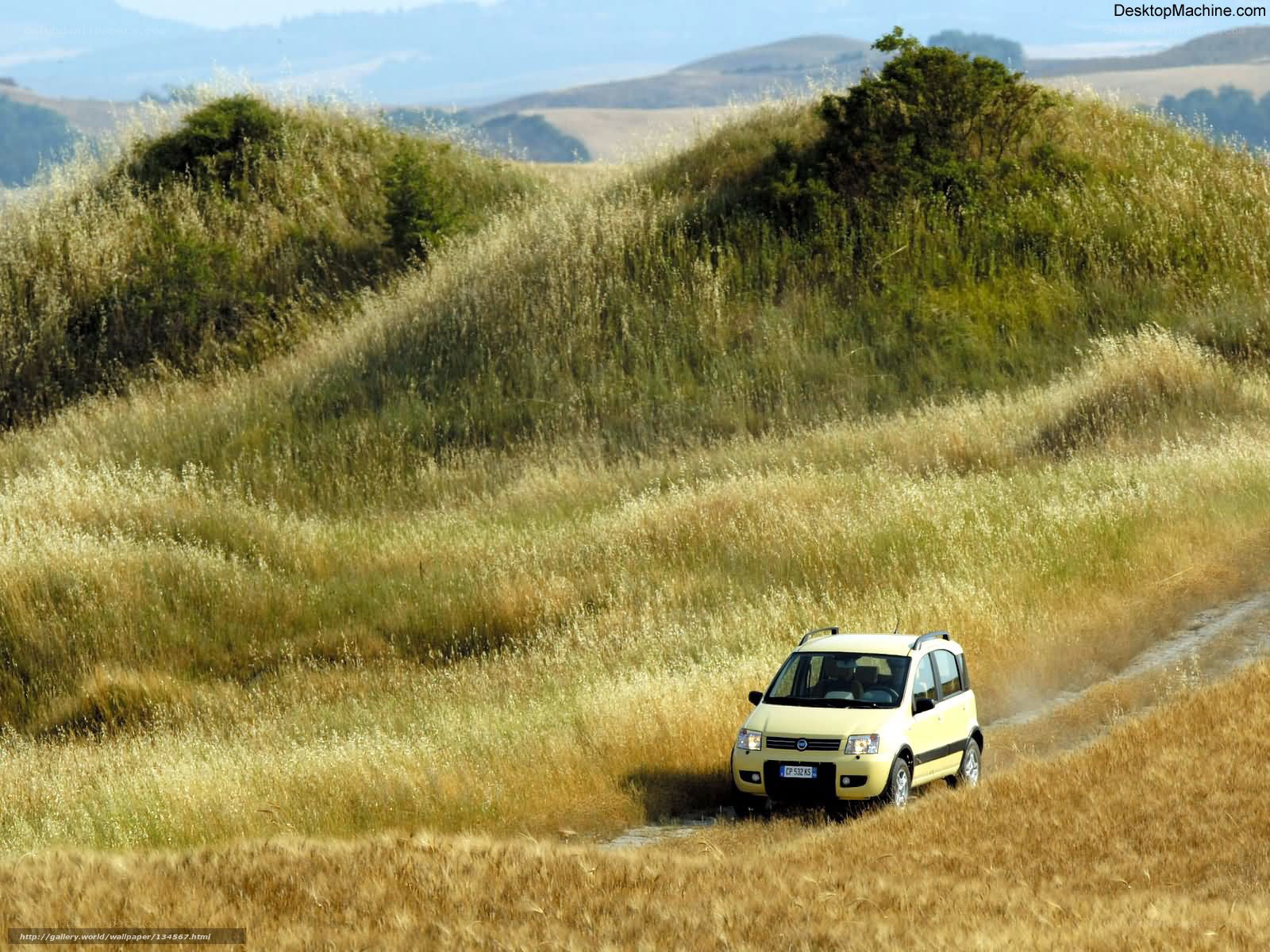Yellow car on a dirt road