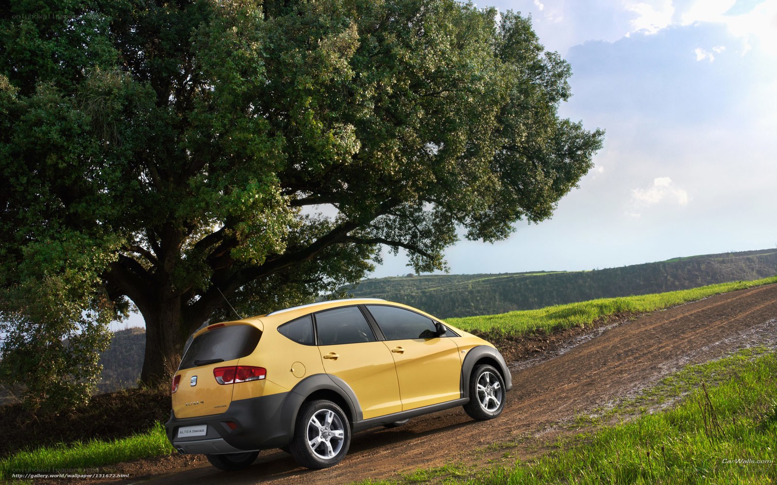 Yellow car on a dirt road