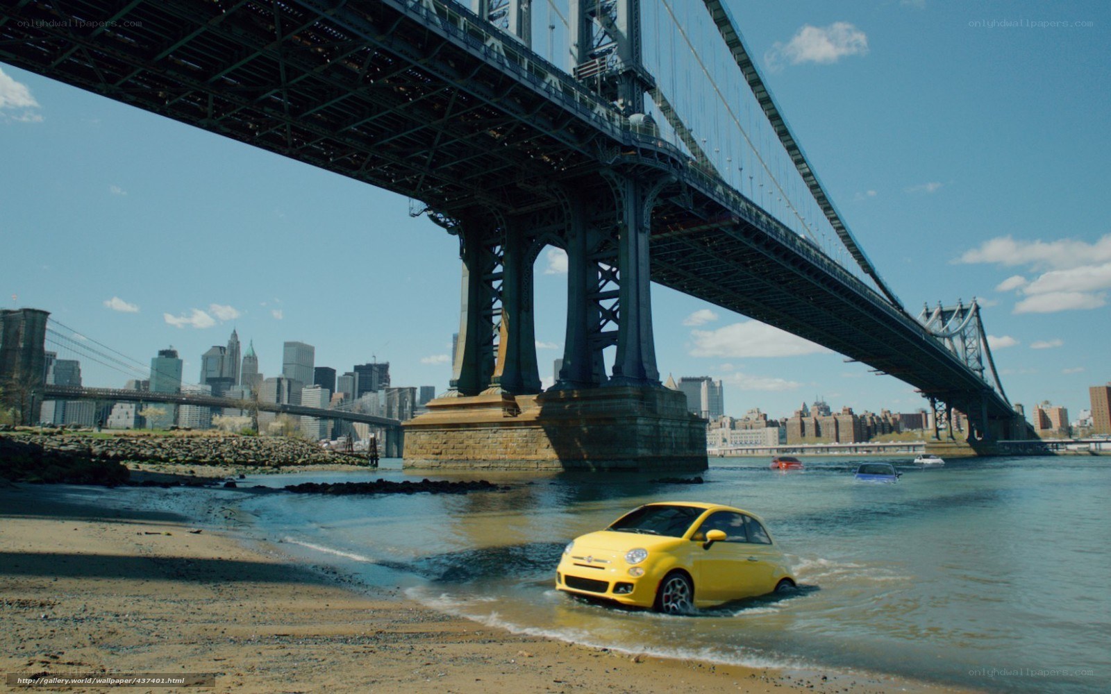 Yellow car on beach under bridge