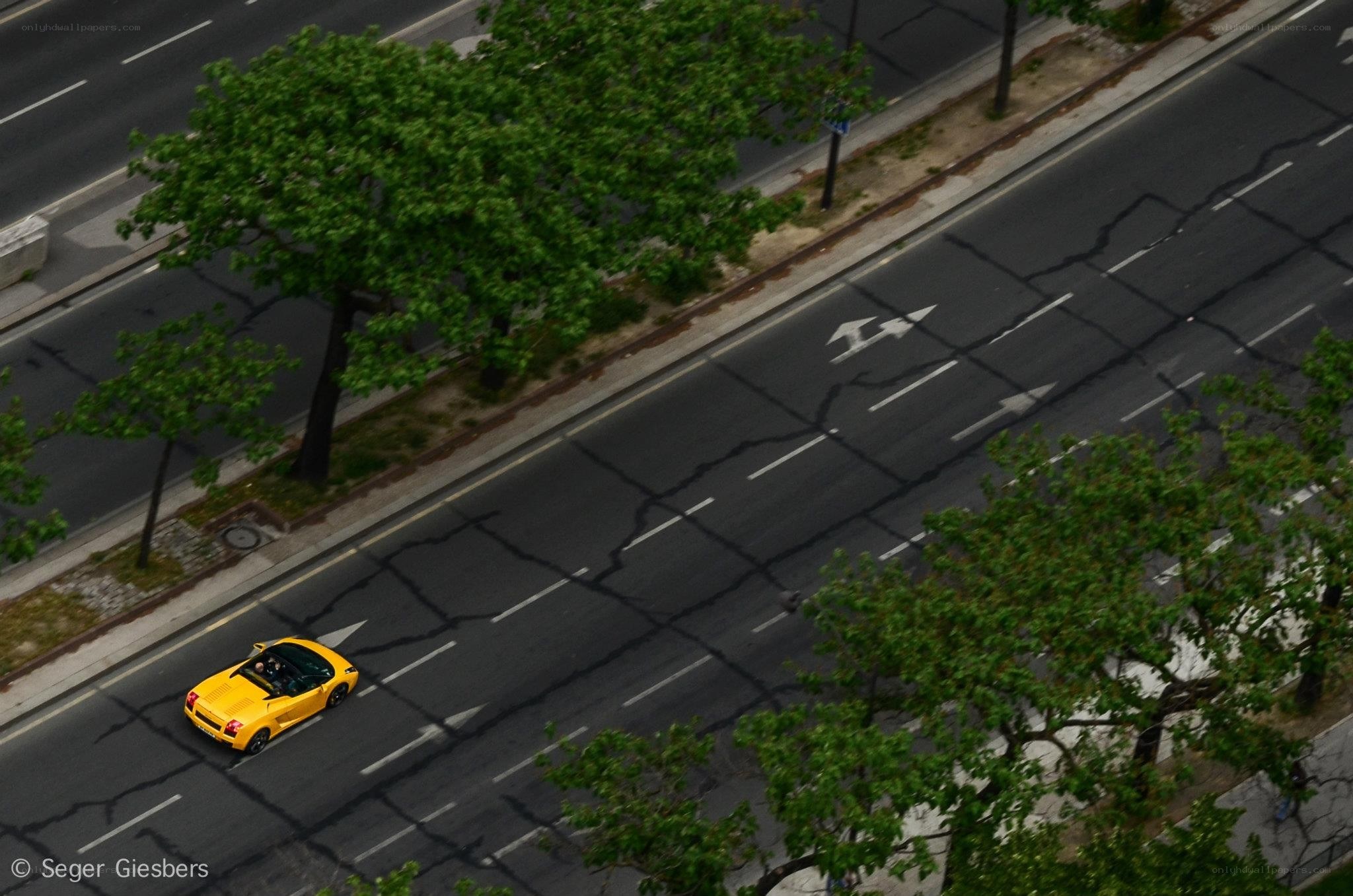 Yellow car on city street