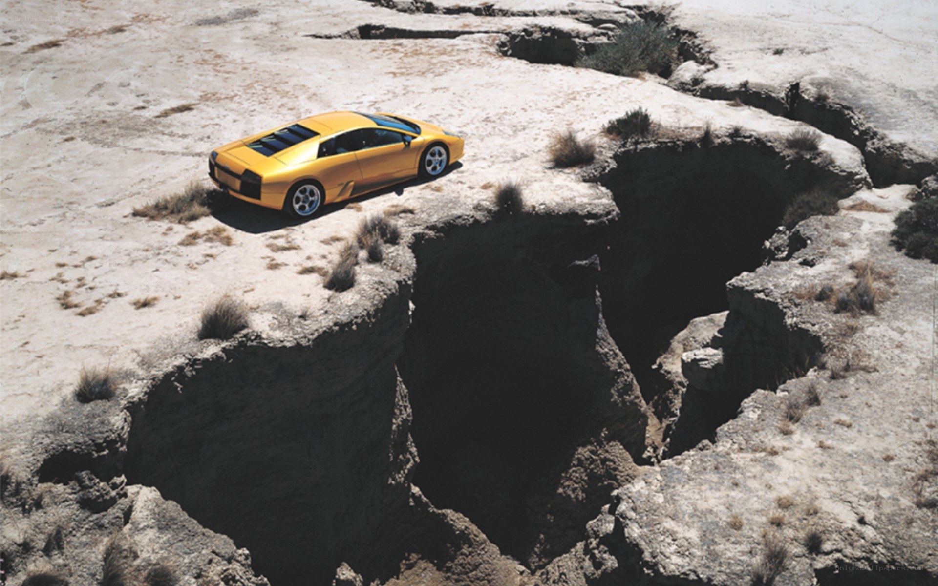 Yellow car on cliff edge