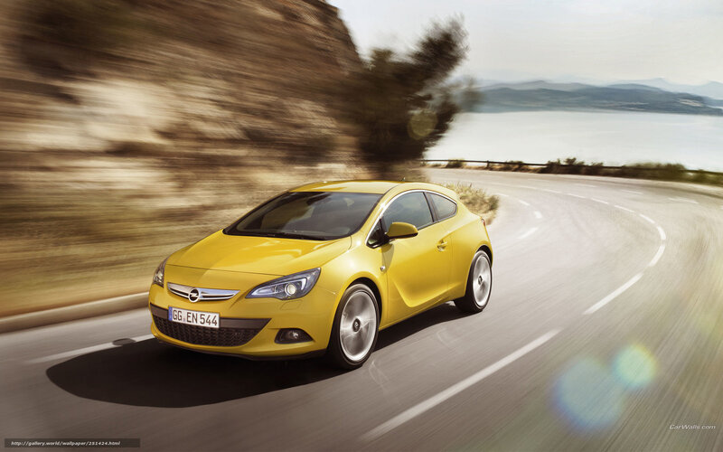 Yellow car on coastal road