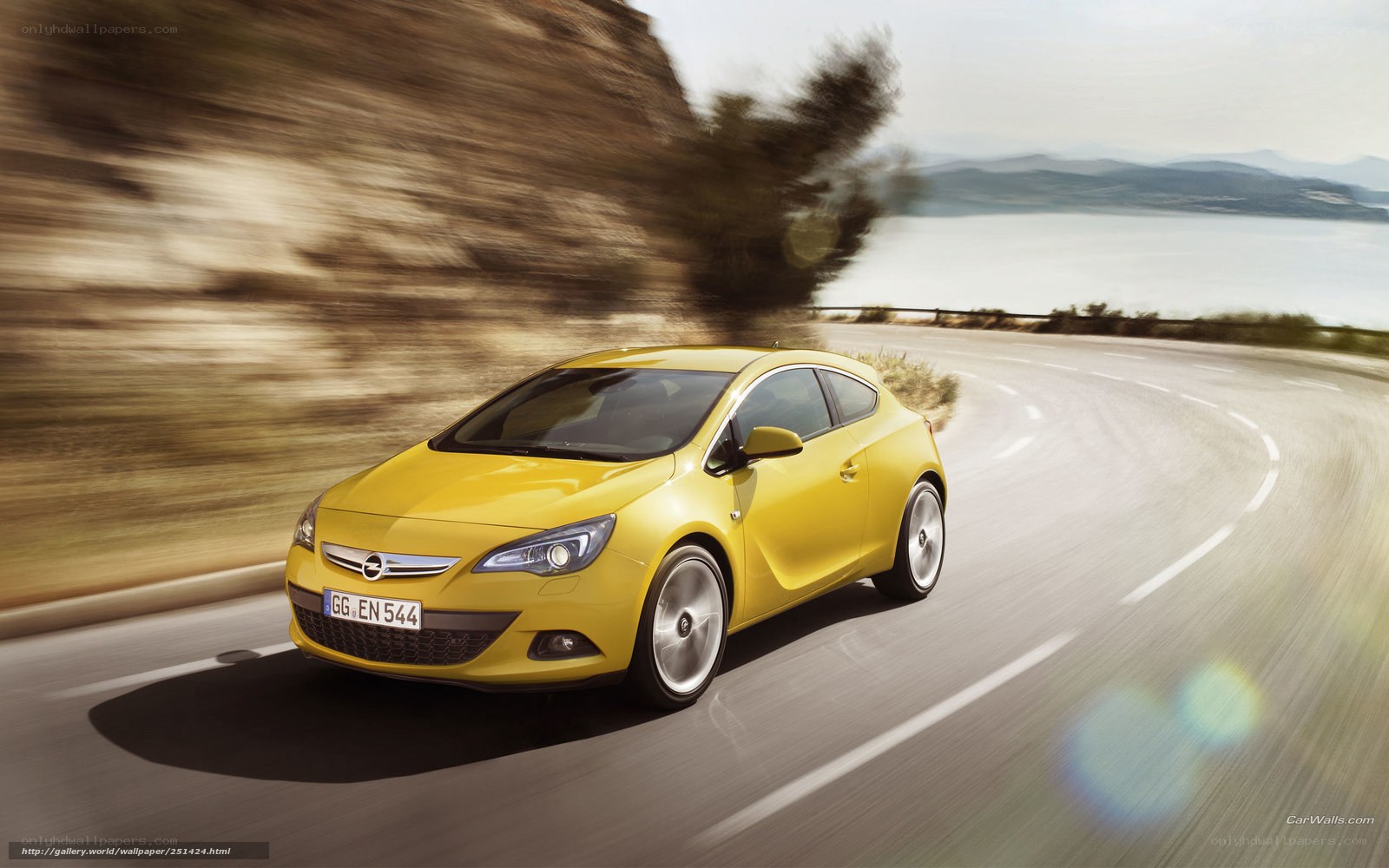 Yellow car on coastal road