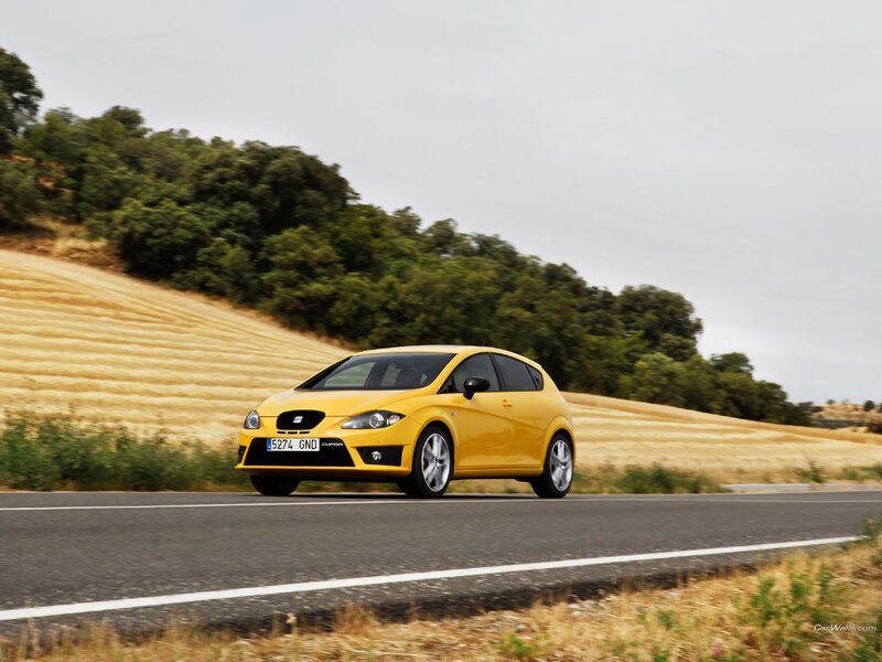 yellow car on country road