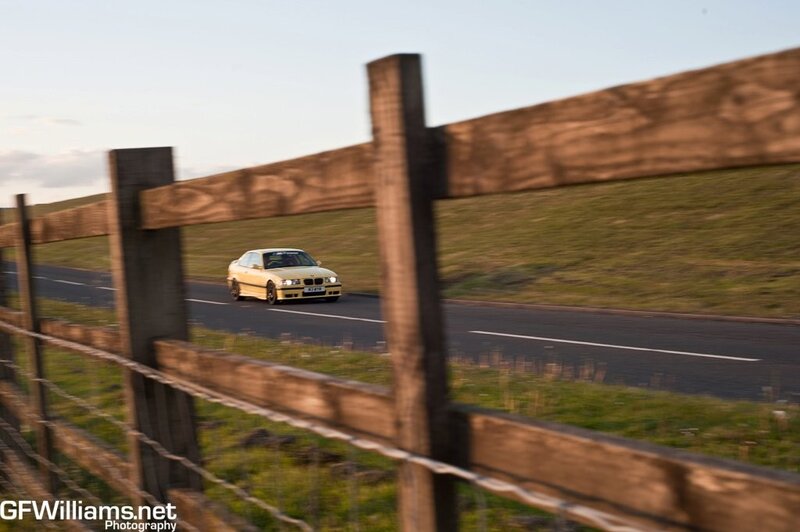 Yellow car on country road