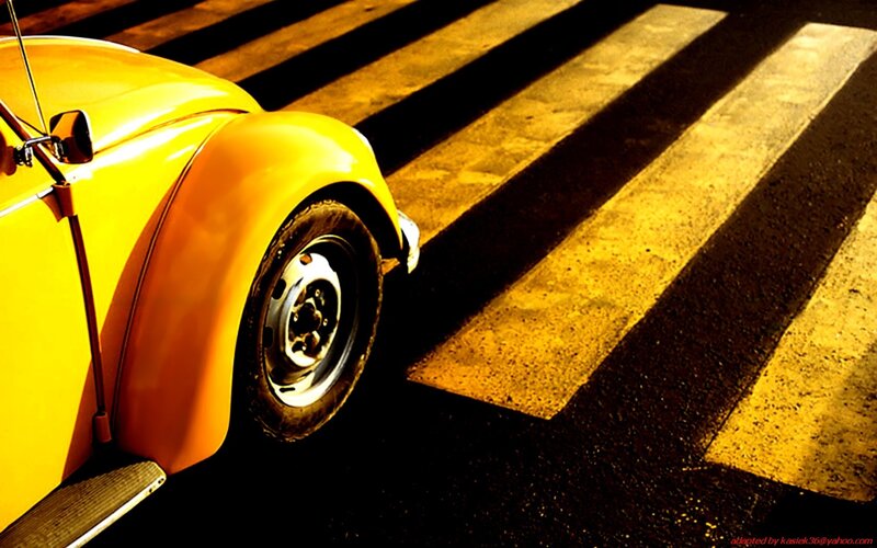 Yellow car on crosswalk