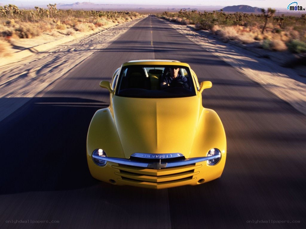 Yellow car on desert road