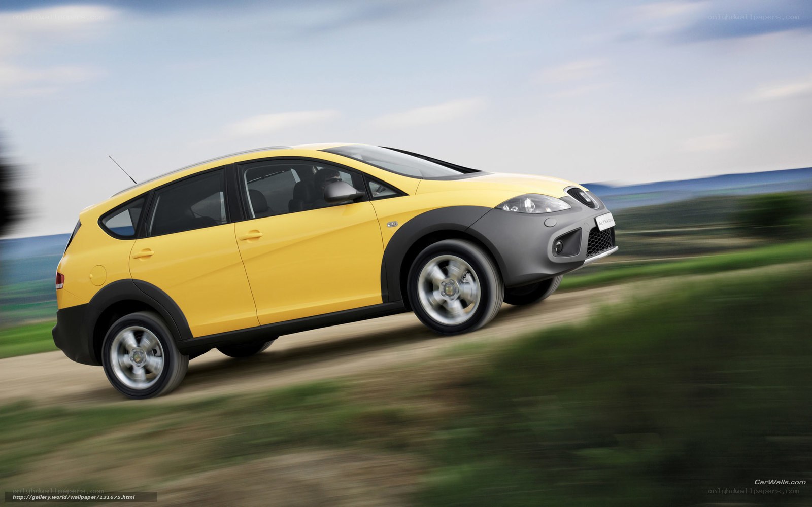 Yellow car on dirt road