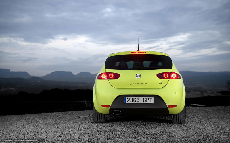 Yellow Car on Gravel