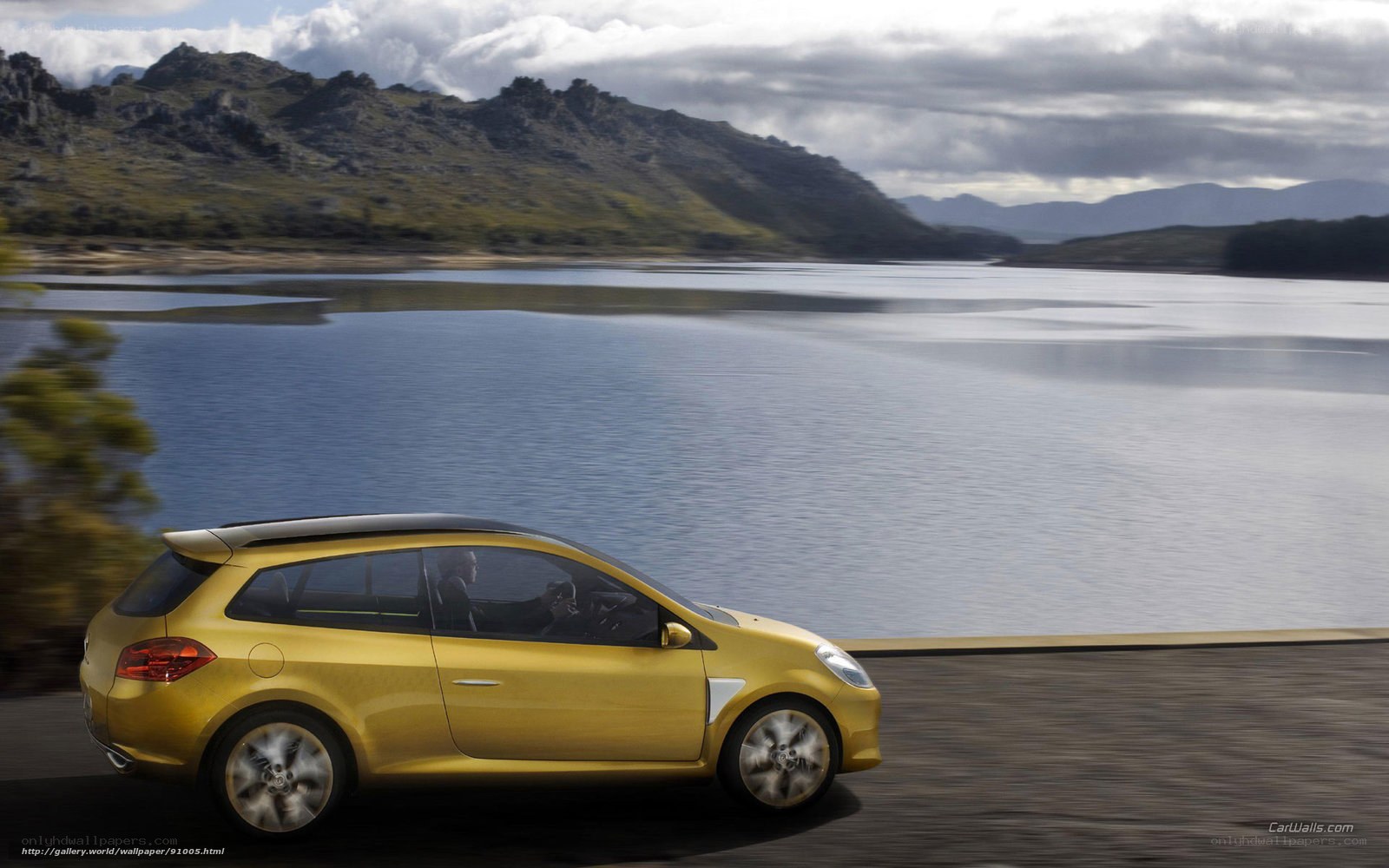 Yellow car on lakeside road