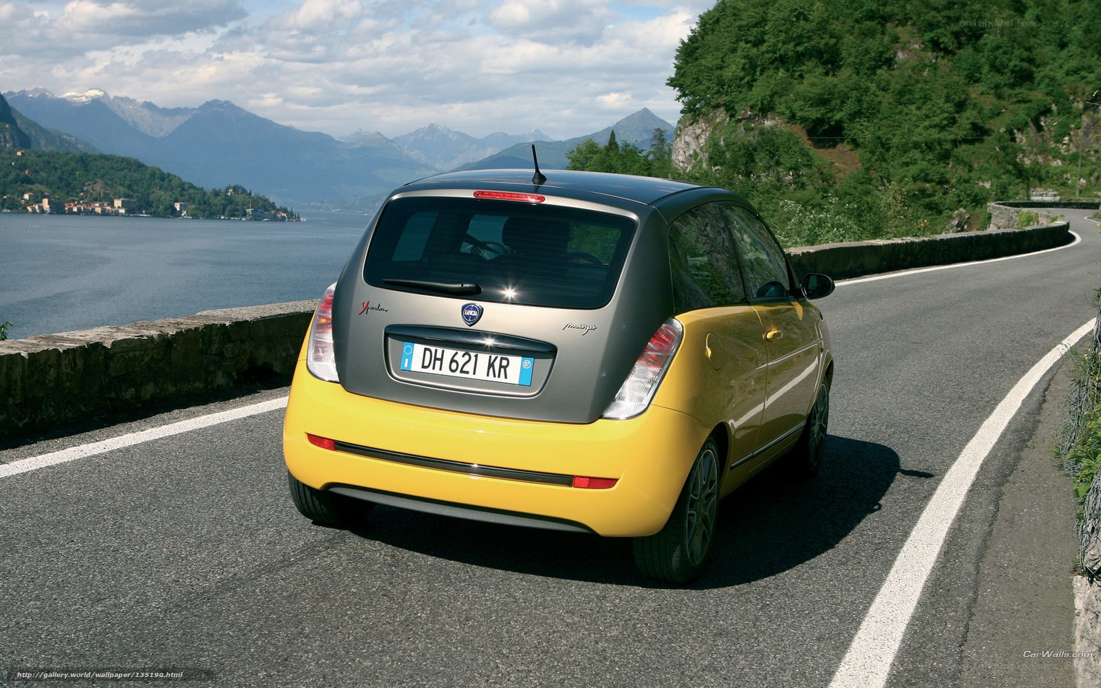 yellow car on mountain road