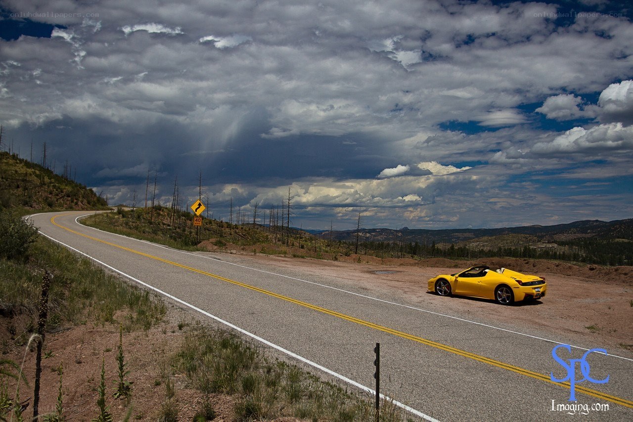 Yellow car on mountain road