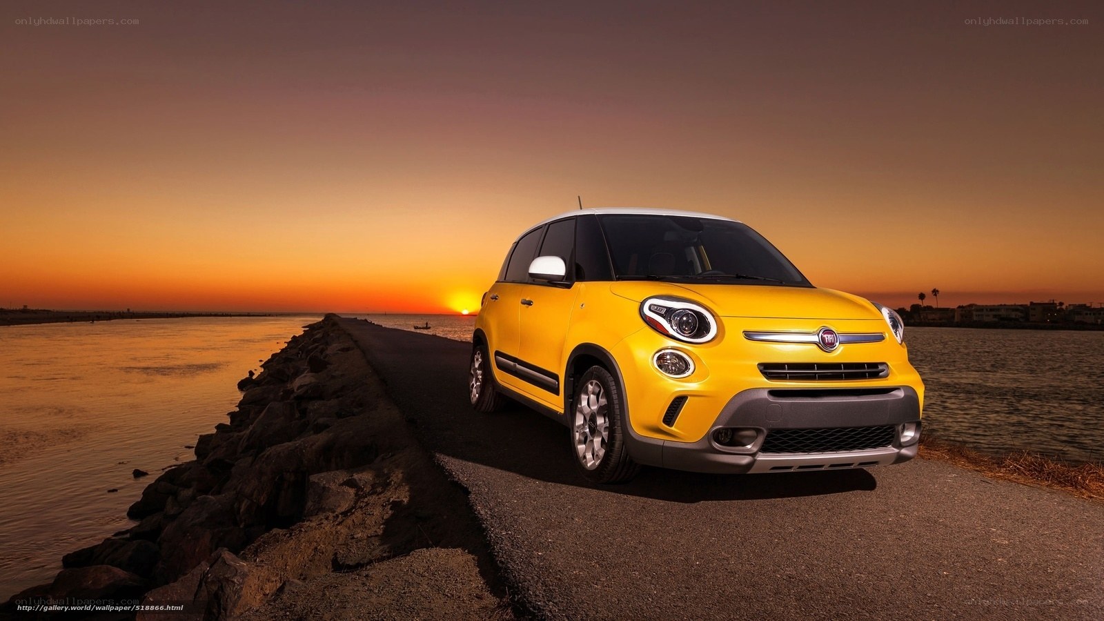 Yellow car on pier at sunset