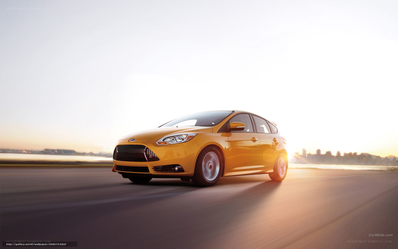 yellow car on road at sunset