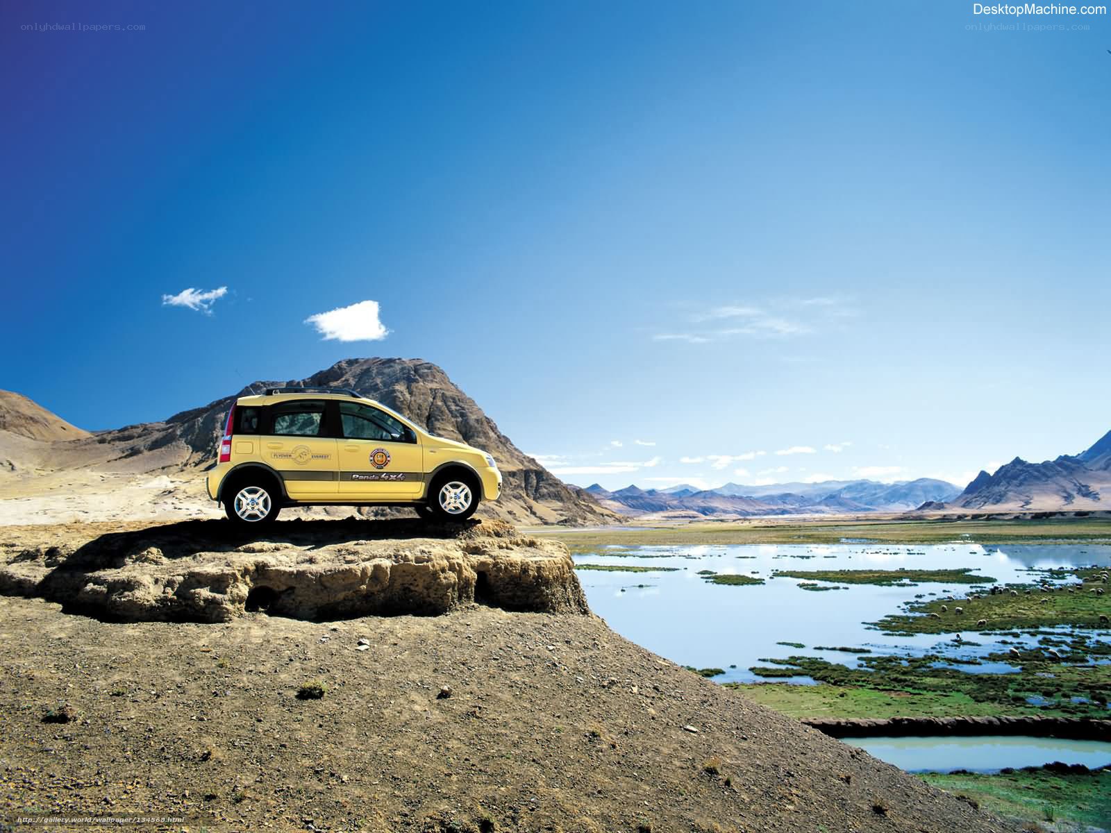 Yellow car on rocky outcrop