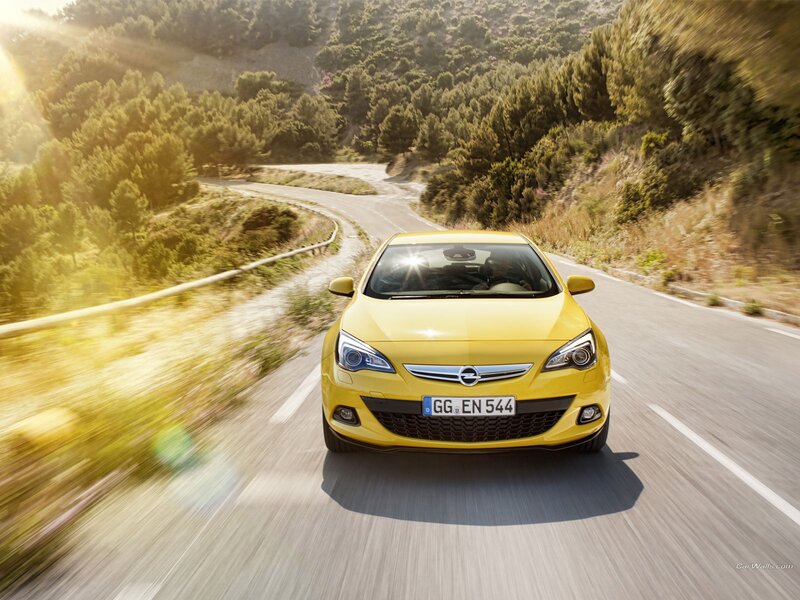 Yellow car on winding road
