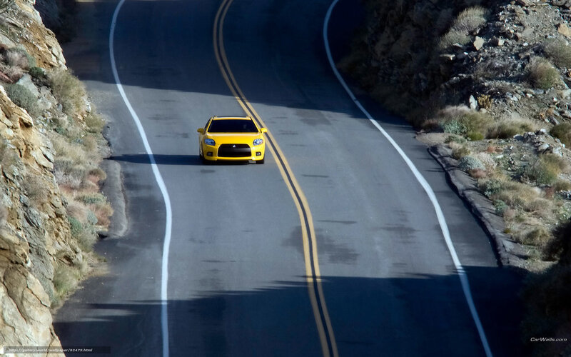 Yellow Car on Winding Road — Dramatic