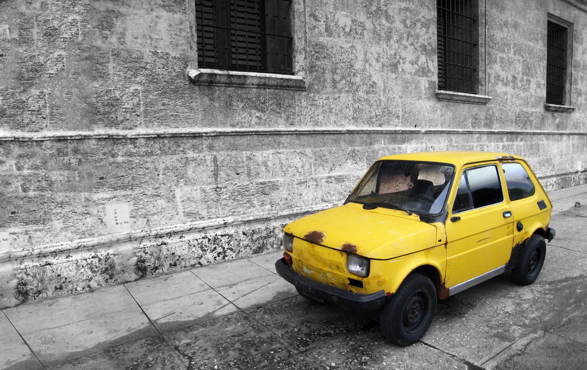 yellow car parked on street
