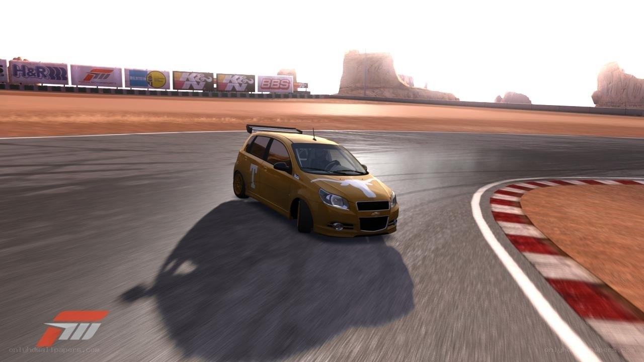 yellow car racing on track