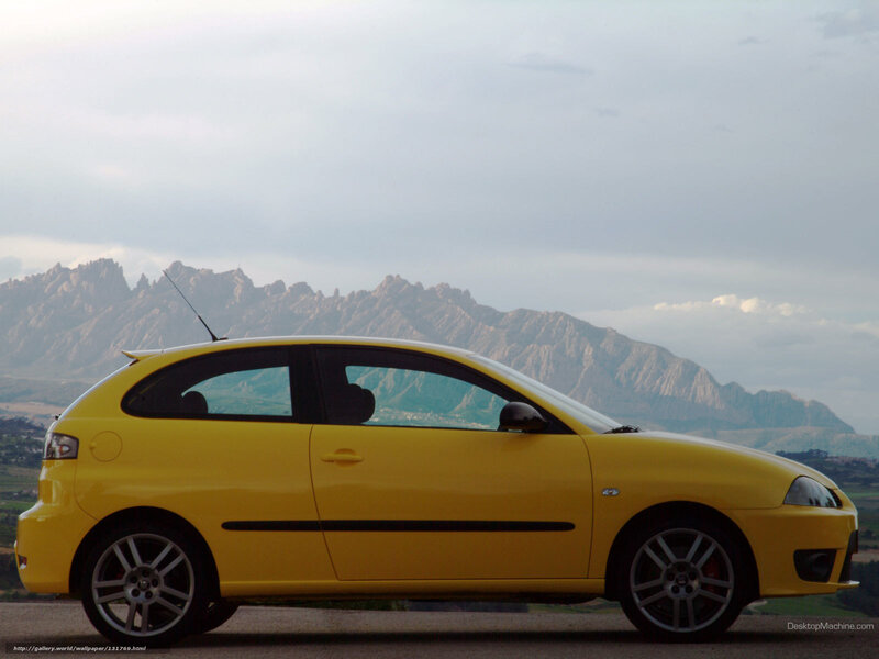 yellow car with mountains