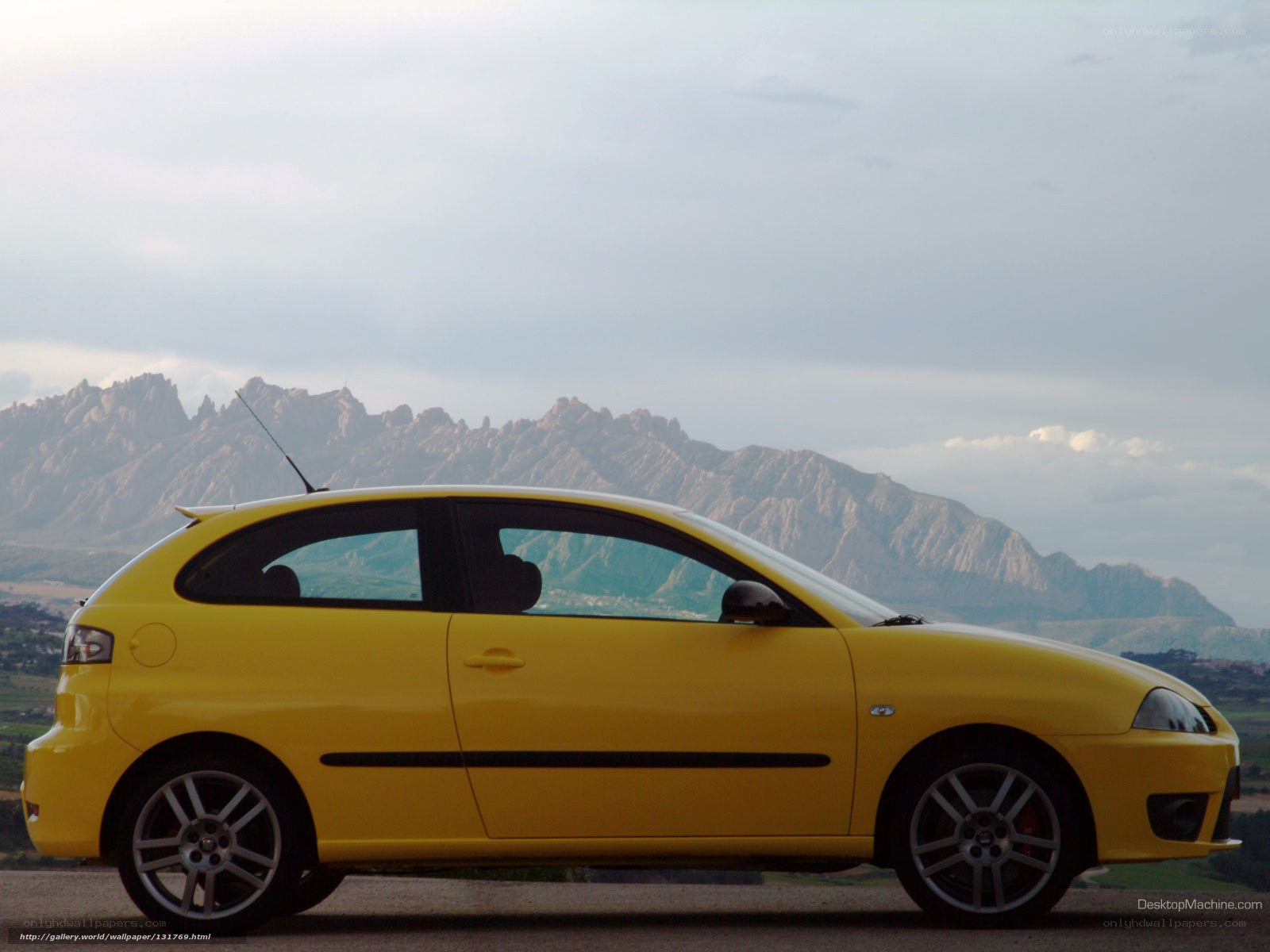 yellow car with mountains