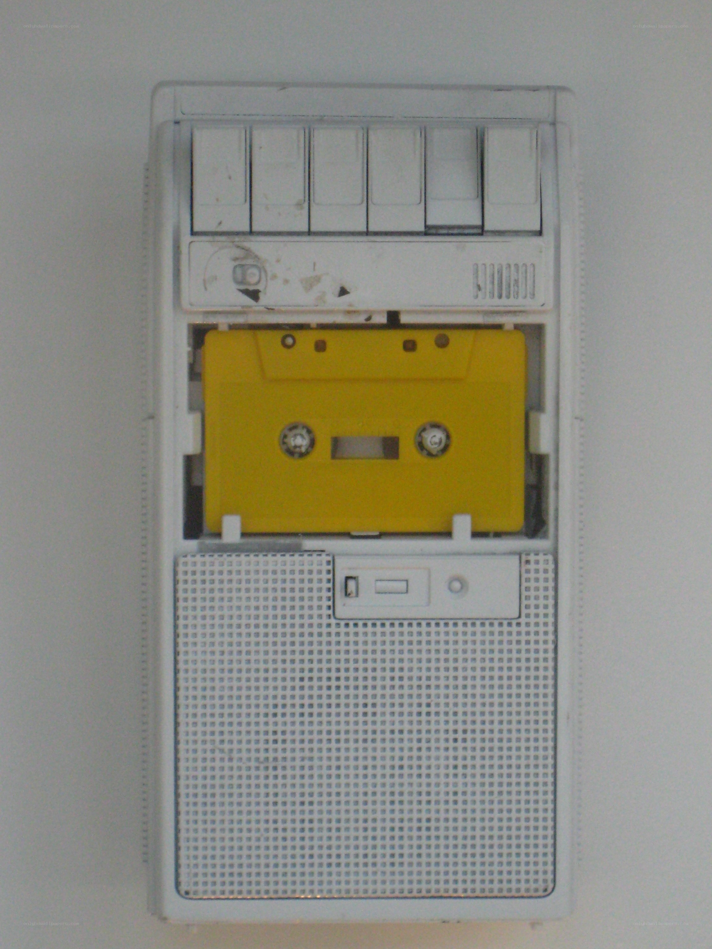 yellow cassette tape in player