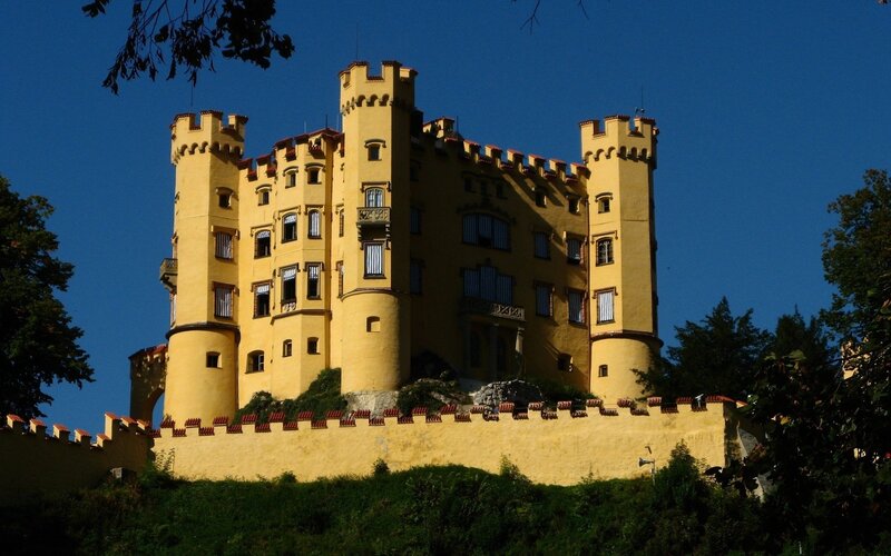 yellow castle on a hill