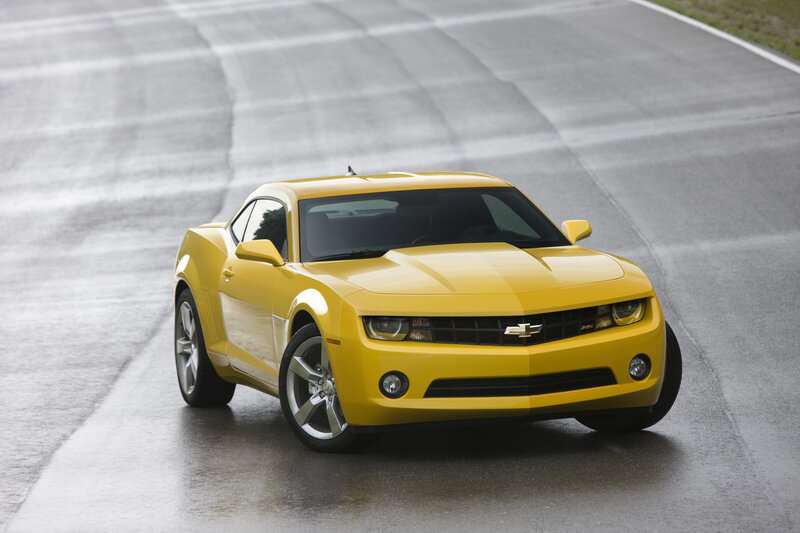 Yellow Chevrolet Camaro on track