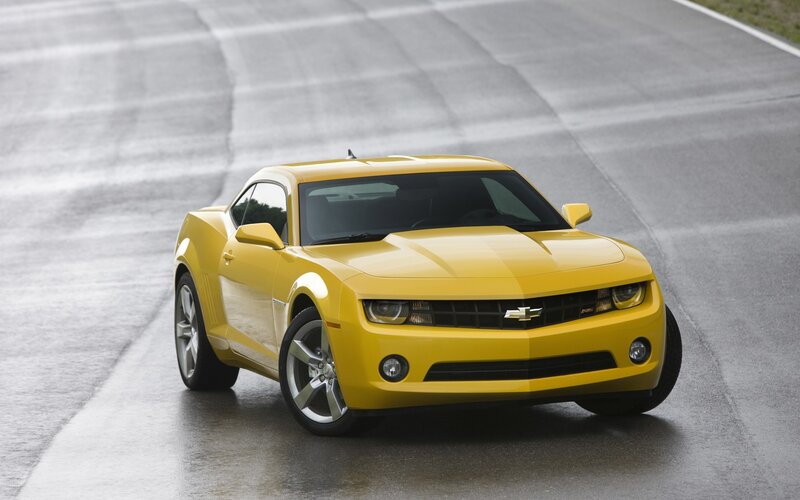 Yellow Chevrolet Camaro on track