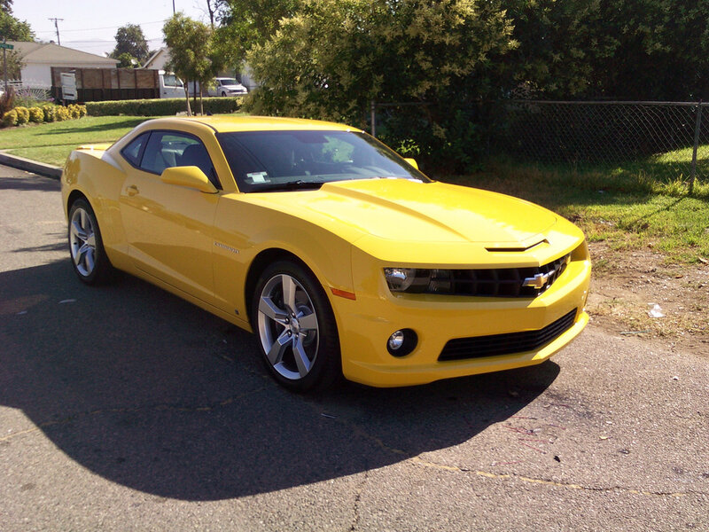 yellow chevrolet camaro parked