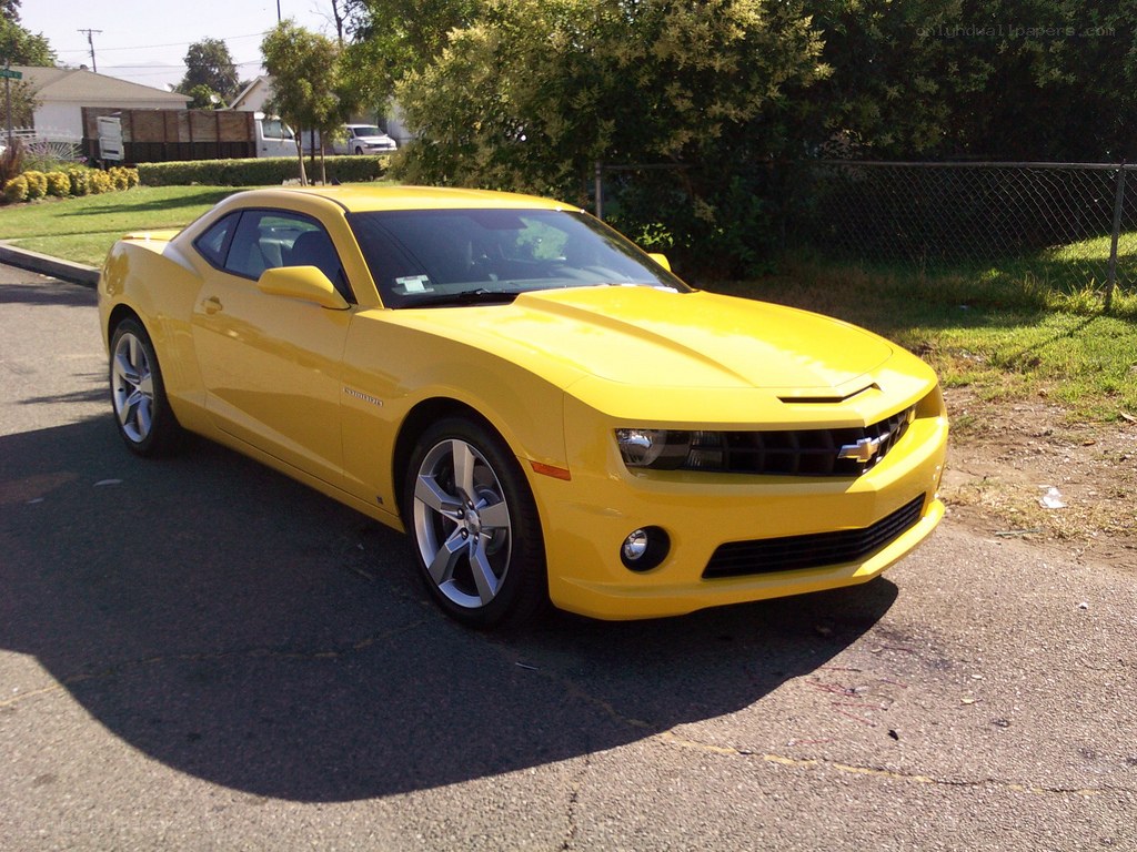yellow chevrolet camaro parked